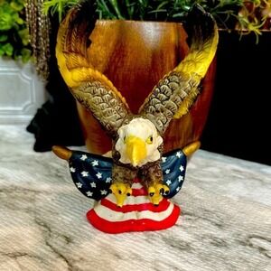 Bald Eagle Ceramic Figurine Perched Over An American Flag